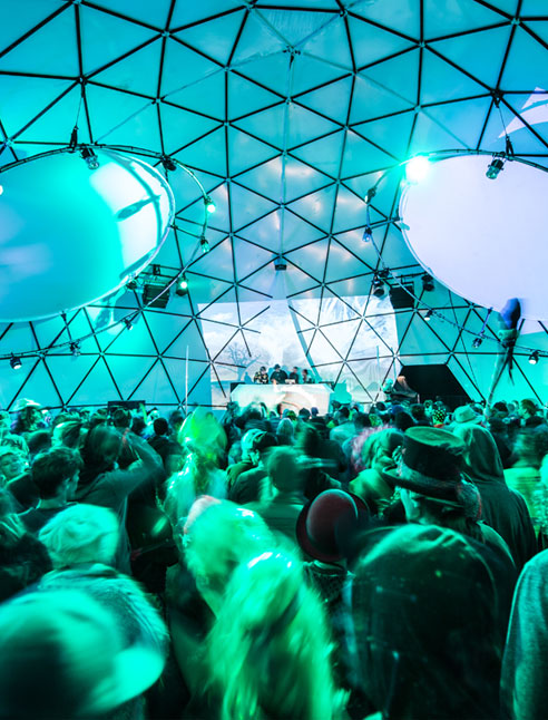 Picture of festival goers in the custom made dome stage.