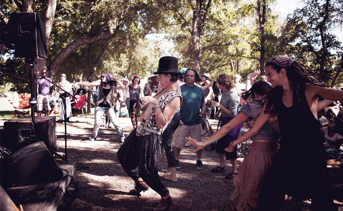 Picture of people dancing to the festival music.
