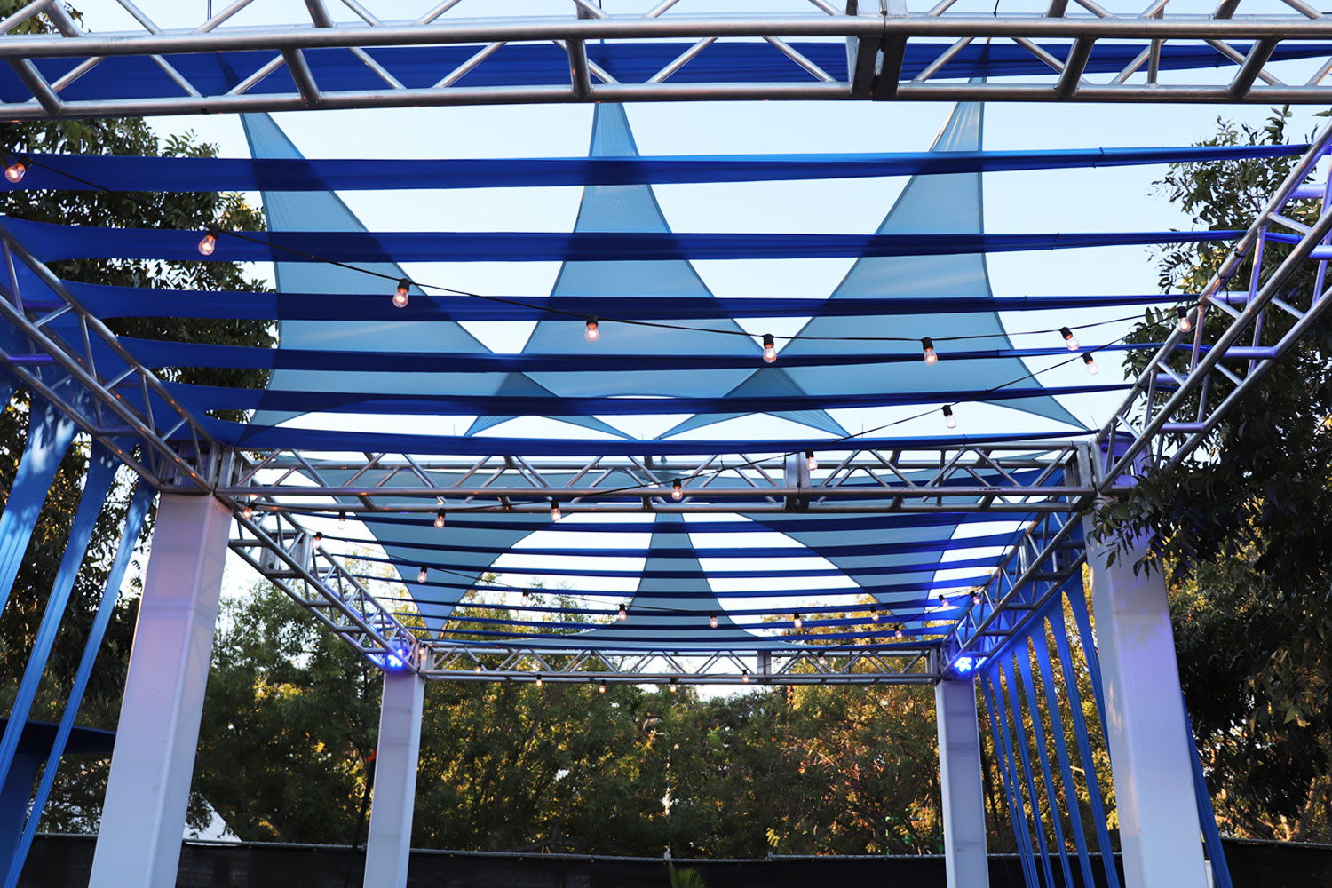 Picture of custom shade structure with festoon lighting.