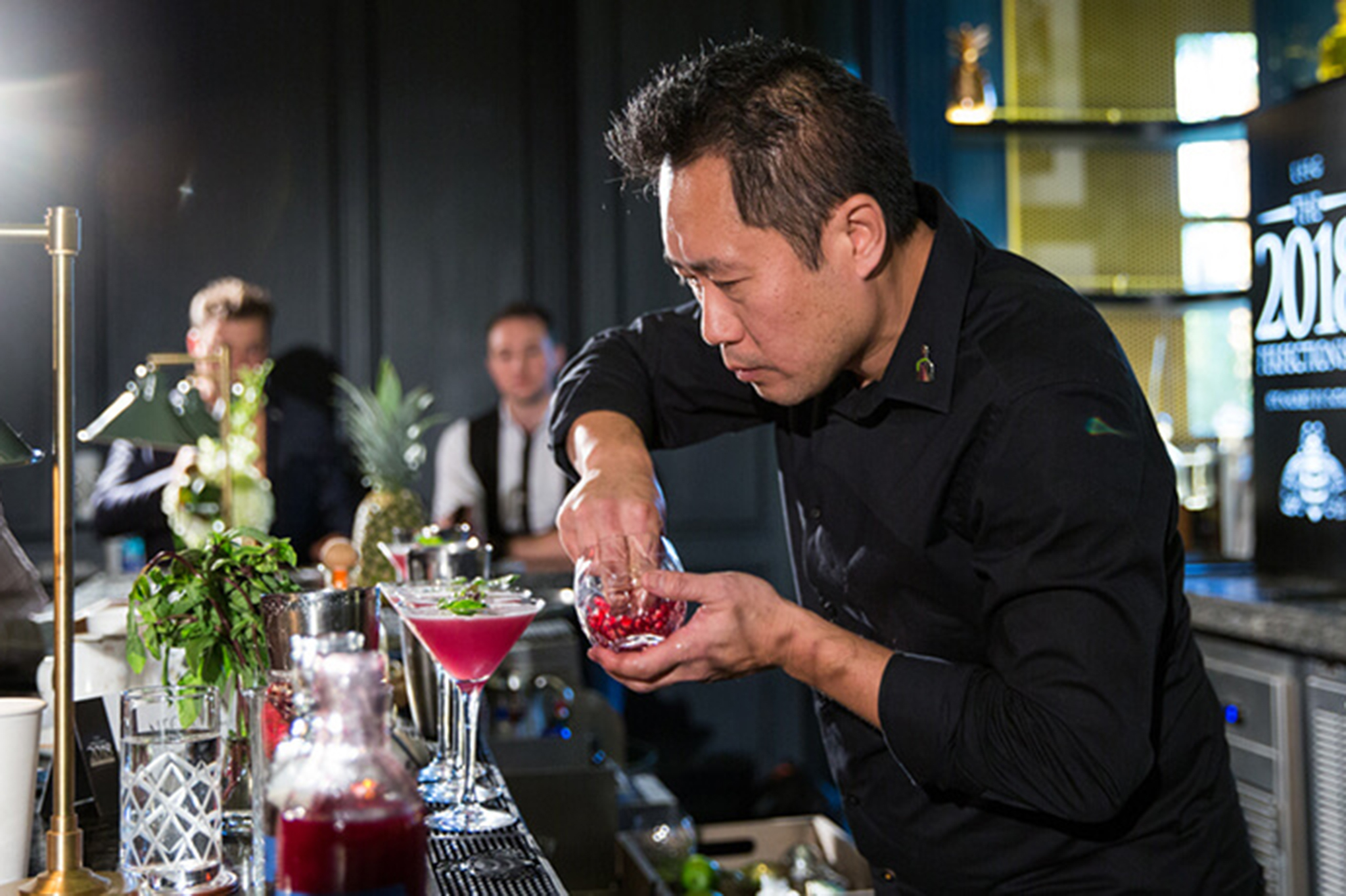 Picture of a mixologist concocting Patron cocktails.