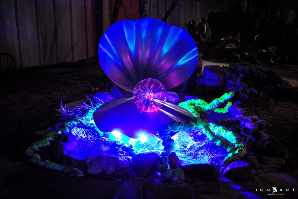 Picture of a clam with a plasma ball on the inside.