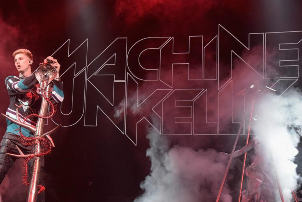 Picture of MGK on stage with fog machine going.