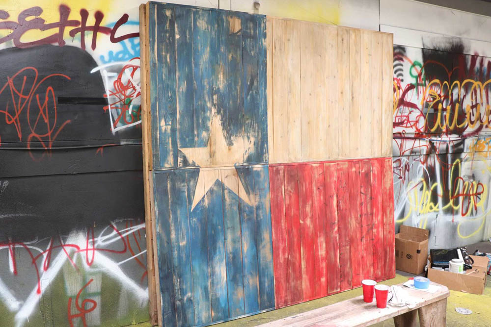 Picture of a rustic texas flag backdrop.