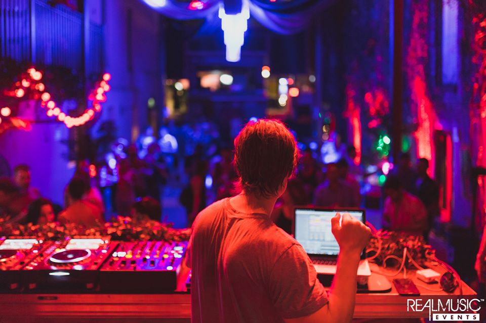 Picture of a DJ mixing at the event.
