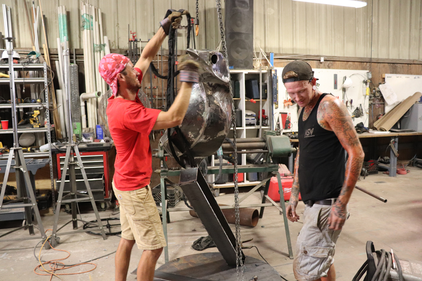 Picture of Art Seen Alliance employees working on the mockingbird sculpture.